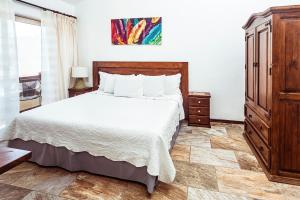 Postel nebo postele na pokoji v ubytování Fabiola Condo Hotel