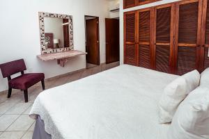 Postel nebo postele na pokoji v ubytování Fabiola Condo Hotel