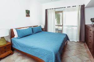 Postel nebo postele na pokoji v ubytování Fabiola Condo Hotel