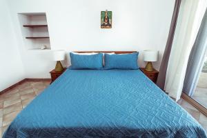 Postel nebo postele na pokoji v ubytování Fabiola Condo Hotel