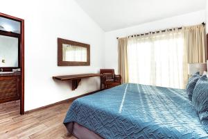 Postel nebo postele na pokoji v ubytování Fabiola Condo Hotel