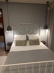 Ένα ή περισσότερα κρεβάτια σε δωμάτιο στο A Casinha da Ria