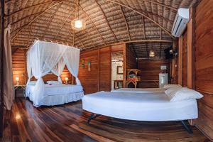 a bedroom with two beds in a room at Pousada BGK in Barra Grande