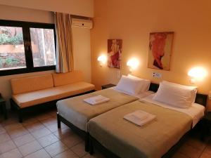 Кровать или кровати в номере Villiana Holiday Apartments