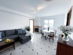 a living room with a couch and a table at La Zenia Beach House in Alicante