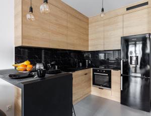 Kuchyňa alebo kuchynka v ubytovaní Portowa Przystań by Comfort Apartments