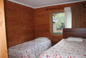 Ένα ή περισσότερα κρεβάτια σε δωμάτιο στο Casa Country Pucón