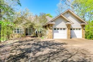 a house with a driveway in front of it at 18814 - 14 Juego Way in Hot Springs Village