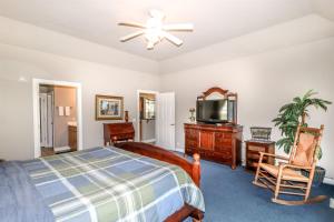 a bedroom with a bed and a flat screen tv at 18814 - 14 Juego Way in Hot Springs Village