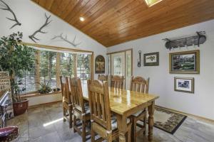 a dining room with a wooden table and chairs at 18802 - 2 Granada Way in Hot Springs Village