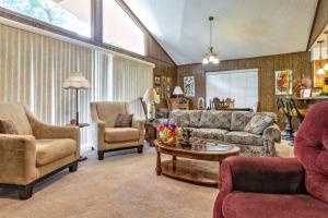 a living room with couches and chairs and a table at 05210 - 8 South Pego Way in Hot Springs Village