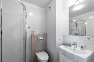 Kúpeľňa v ubytovaní Waw Apartamenty Manhattan