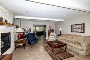 a living room with a couch and a fireplace at 01107 - 7 Frontera Circle in Hot Springs Village