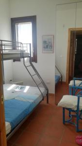 Dviaukštė lova arba lovos apgyvendinimo įstaigoje Villetta Santa Maria al Bagno