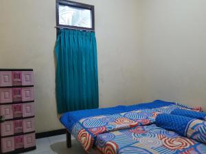 Gallery image of OYO Homes 91083 Desa Wisata Plosokuning Syariah in Soprayan