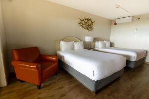 Postel nebo postele na pokoji v ubytování Emerald Beach Hotel Corpus Christi