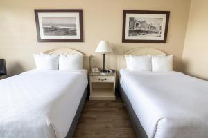 Postel nebo postele na pokoji v ubytování Emerald Beach Hotel Corpus Christi