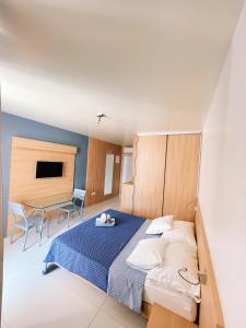 Ένα ή περισσότερα κρεβάτια σε δωμάτιο στο Bila Vila Apartments