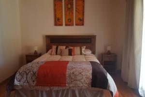 Giường trong phòng chung tại Tranquilidad y descanso en Villarrica - Pucón