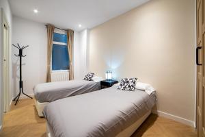 Ένα ή περισσότερα κρεβάτια σε δωμάτιο στο Apartamento Deluxe Bella Easo by Cisan Rentals