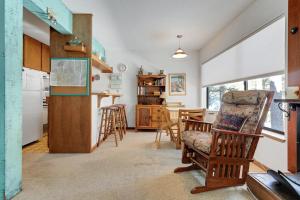 a kitchen and dining room with a table and chairs at Year Round Condo- Sleeps 5! - Tamarack #17 in Bear Valley