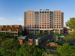 an aerial view of a hotel in a city at Radisson Blu Hotel Antananarivo Waterfront in Antananarivo