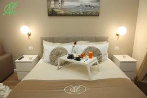 Ein Bett oder Betten in einem Zimmer der Unterkunft MC Apartments