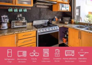 a kitchen with a stove and a sink at Hostal La Paz & Love Guadalajara in Guadalajara