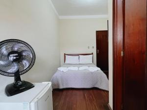 Hotel Chão Mineiro客房内的一张或多张床位