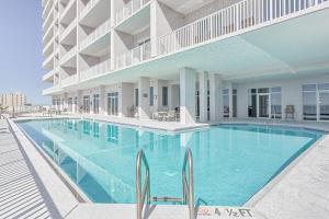 a large swimming pool in front of a building at Windemere Condominiums II in Pensacola