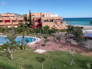 an aerial view of a resort with a swimming pool and the ocean at Beautiful Apartment in Almer a with Swimming Pool in Playas de Vera