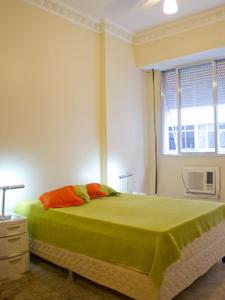 מיטה או מיטות בחדר ב-Apartamento Ouro Negro