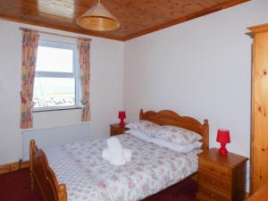 Uma cama ou camas num quarto em Seaview Cottage