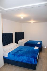 מיטה או מיטות בחדר ב-Casa Villa Paz Salento