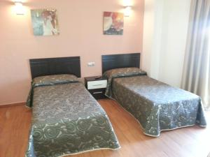 Postel nebo postele na pokoji v ubytování Hotel Almoradi