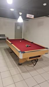 a pool table sitting on top of a room at فندق الحاتمية in Abha