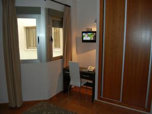 TV a/nebo společenská místnost v ubytování Hotel Almoradi