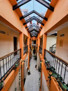 an empty hallway in a building with potted plants at Tradición de Salta in Salta