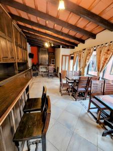 a room with chairs and tables and a bar at Tradición de Salta in Salta