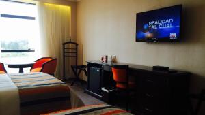 Rúm í herbergi á Carnaval Hotel Casino