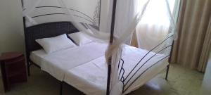Postel nebo postele na pokoji v ubytování Eve Homestay