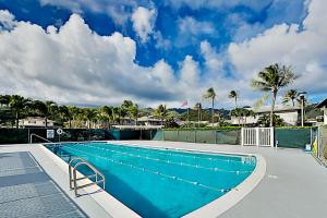 a large swimming pool with a blue at Kuapa Isle Gem Unit 419 in Honolulu