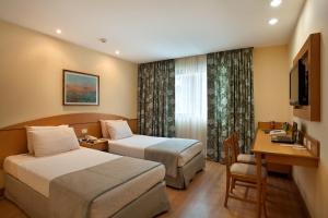 Windsor Martinique Copacabana客房内的一张或多张床位