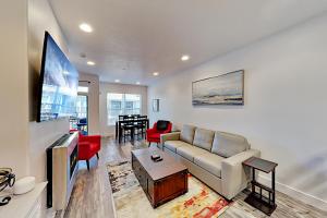 a living room with a couch and a tv at Nevis at Newpark Unit 4 in Park City