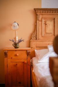 A bed or beds in a room at Diófa Panzió