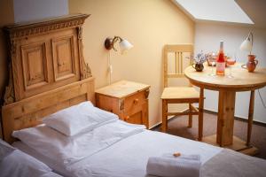 A bed or beds in a room at Diófa Panzió