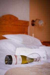 A bed or beds in a room at Diófa Panzió