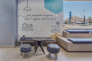 Posezení v ubytování One Chihuahua Norte