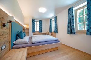 Posteľ alebo postele v izbe v ubytovaní Apartments Alpen Domus
