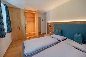 Posteľ alebo postele v izbe v ubytovaní Apartments Alpen Domus